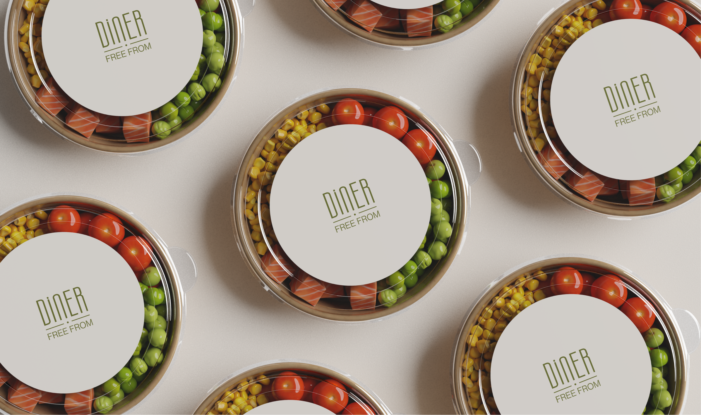 Overhead flat lay of Diner Free From branded salad pots with sweetcorn, peas, tomatoes and salmon