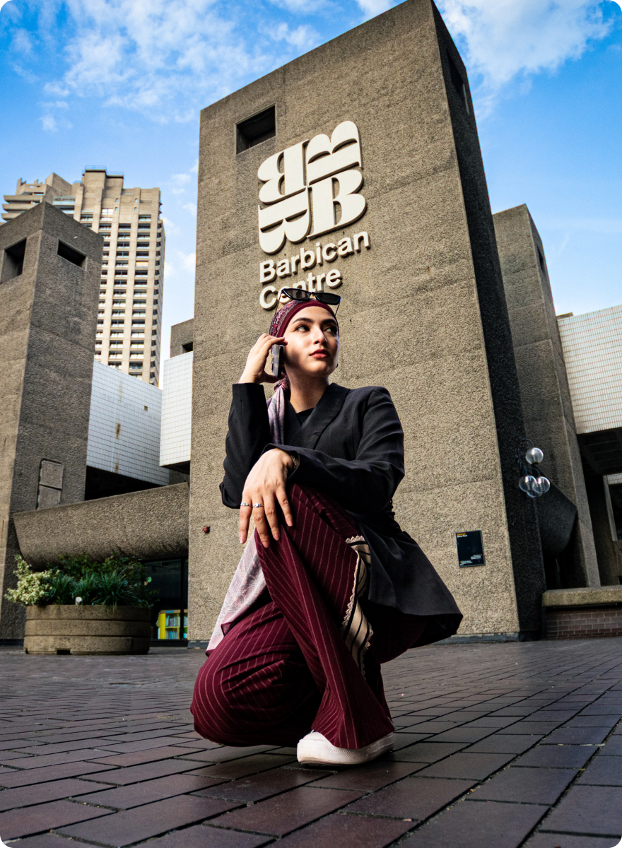 Oppo _ Nazifa Woman in a headscarf on a phone call in front of the Barbican Centre, from the Oppo Reno campaign