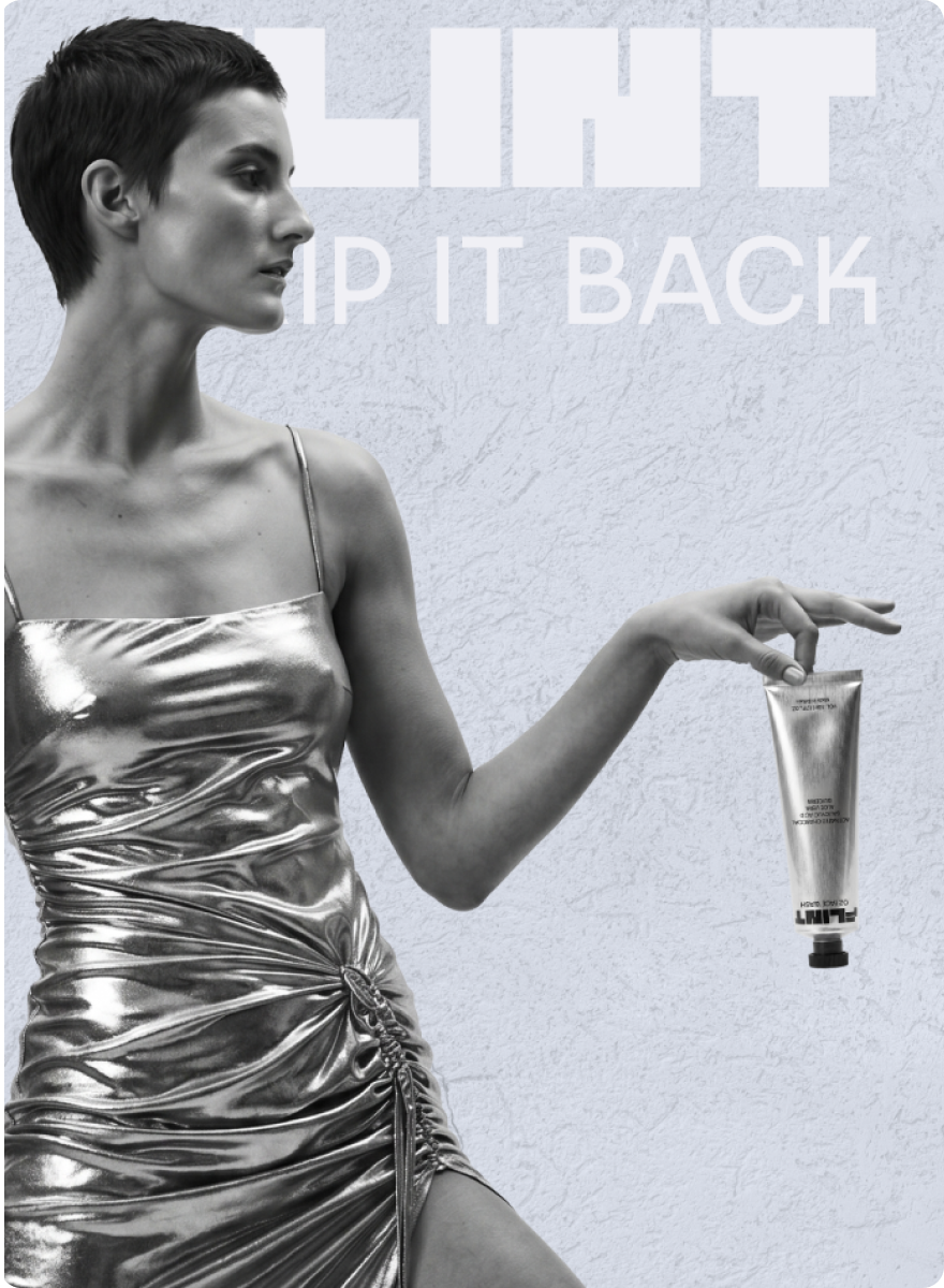 Black and white campaign poster for Flint skincare, a woman with cropped hair in a metallic dress holds a silver product tube, with the FLINT logo and "Strip It Back" tagline overlaid